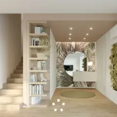 Ingresso casa con libreria in legno, specchio rotondo su carta da parati tropicale e parete verde. Idee d'arredo moderne e accoglienti.