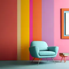 Poltrona azzurra su sfondo a strisce verticali con vivaci colori primaverili. Un quadro arancione e una pila di libri completano la scena.
