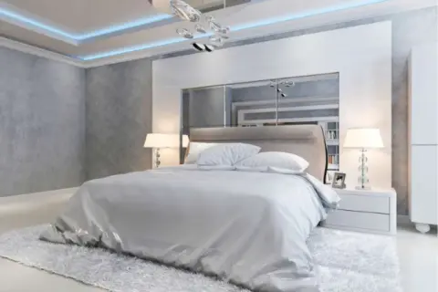 Testata letto moderna con pannelli in cartongesso e specchi, perfetta per idee camera da letto eleganti.