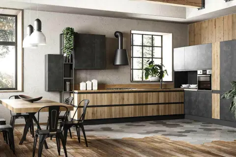 Cucina stile industrial con mobili in legno e metallo, isola centrale e tavolo da pranzo.