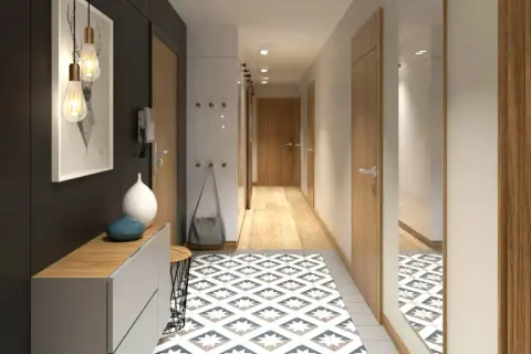 Un corridoio moderno e accogliente, perfetto per arredare con stile. Tappeto geometrico, mobili essenziali e luci d'atmosfera creano un'entrata invitante.