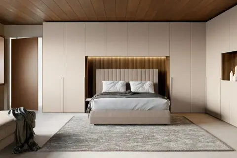 Idee per riporre la camera da letto: armadi a muro con cabina armadio integrata, letto contenitore e panca contenitiva.