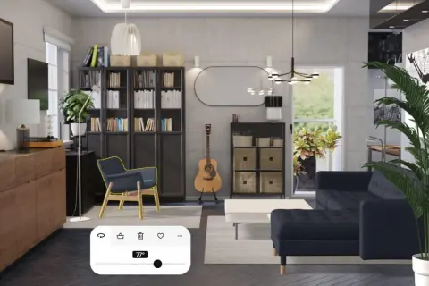 Arredamento studio casa: soggiorno moderno con divano blu, librerie, poltrona, chitarra e un pannello di controllo temperatura.
