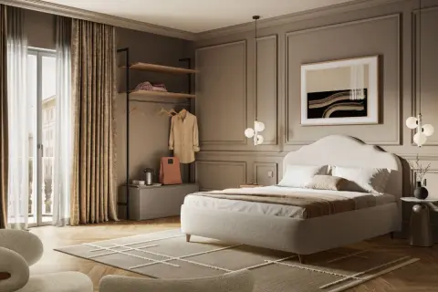 Camera da letto elegante, perfetta per arredare un B&B. Letto imbottito, armadio a giorno, poltrone e un quadro astratto creano un'atmosfera accogliente.