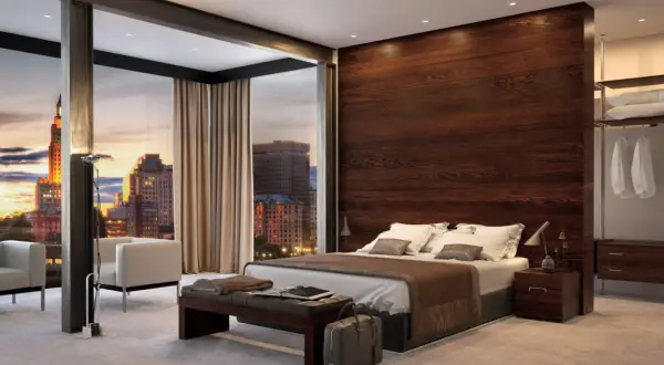 Elegante parete dietro letto in legno scuro, con vista panoramica sulla città al tramonto. Idee d'arredo moderne e raffinate.
