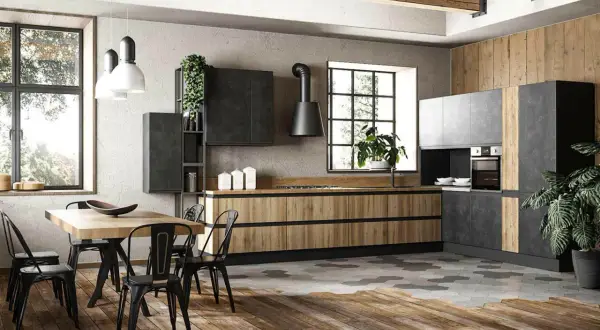 Cucina stile industrial con mobili in legno e metallo, isola centrale e tavolo da pranzo.