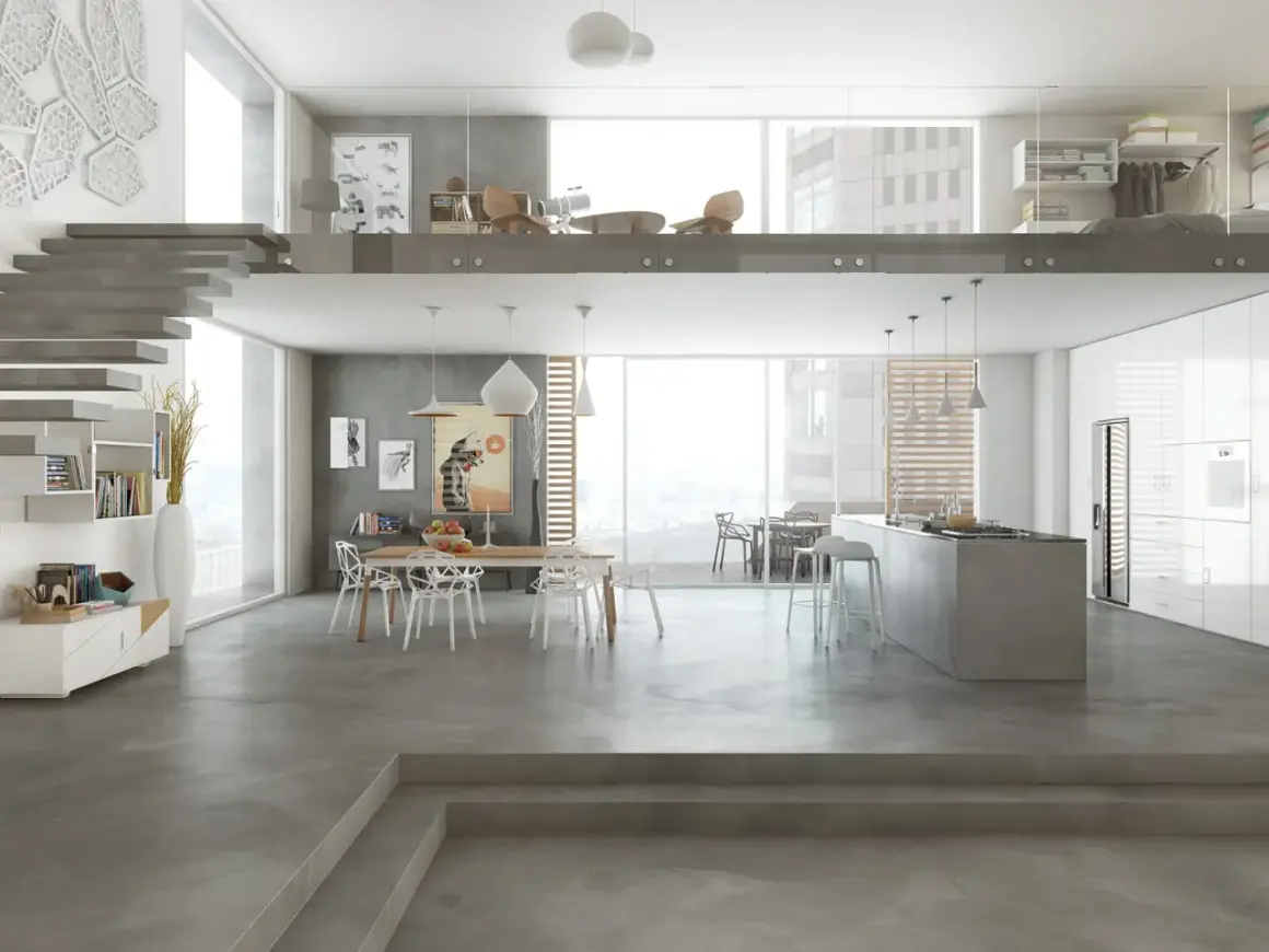 Interni moderni con cucina a isola, zona pranzo e soppalco. I **colori resina cucina** dominano il pavimento e le superfici, creando un ambiente minimalista e sofisticato.