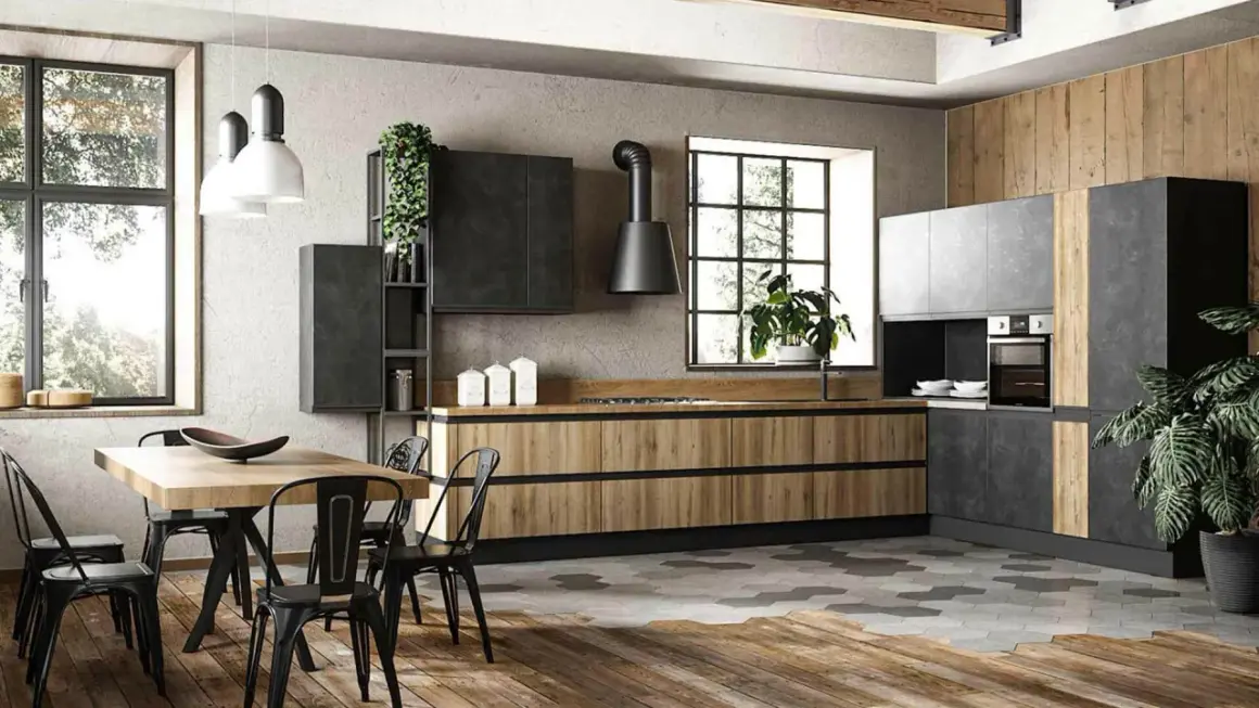 Cucina stile industrial con mobili in legno e metallo, isola centrale e tavolo da pranzo.