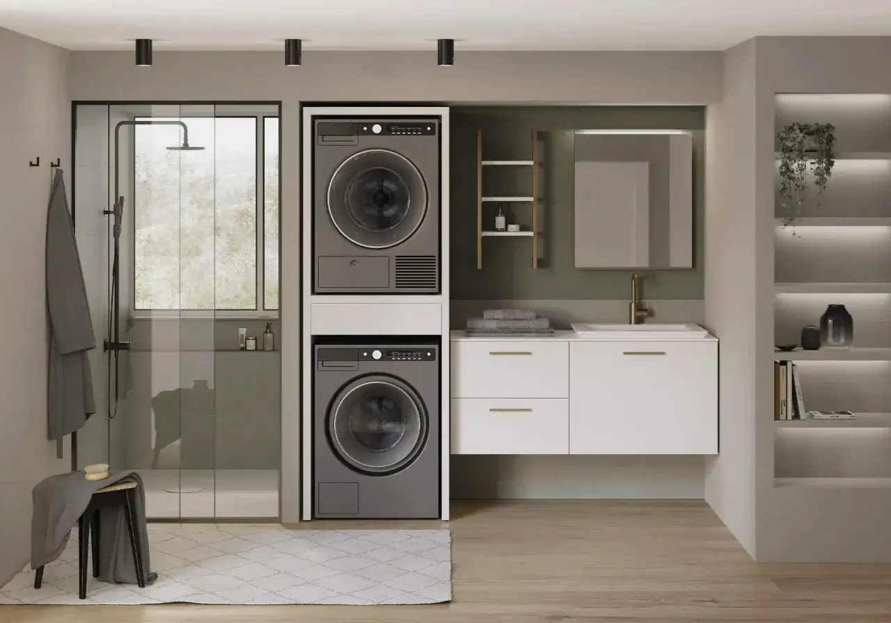 Un moderno progetto bagno con lavanderia integrata: doccia, lavatrice, asciugatrice e mobile lavabo.