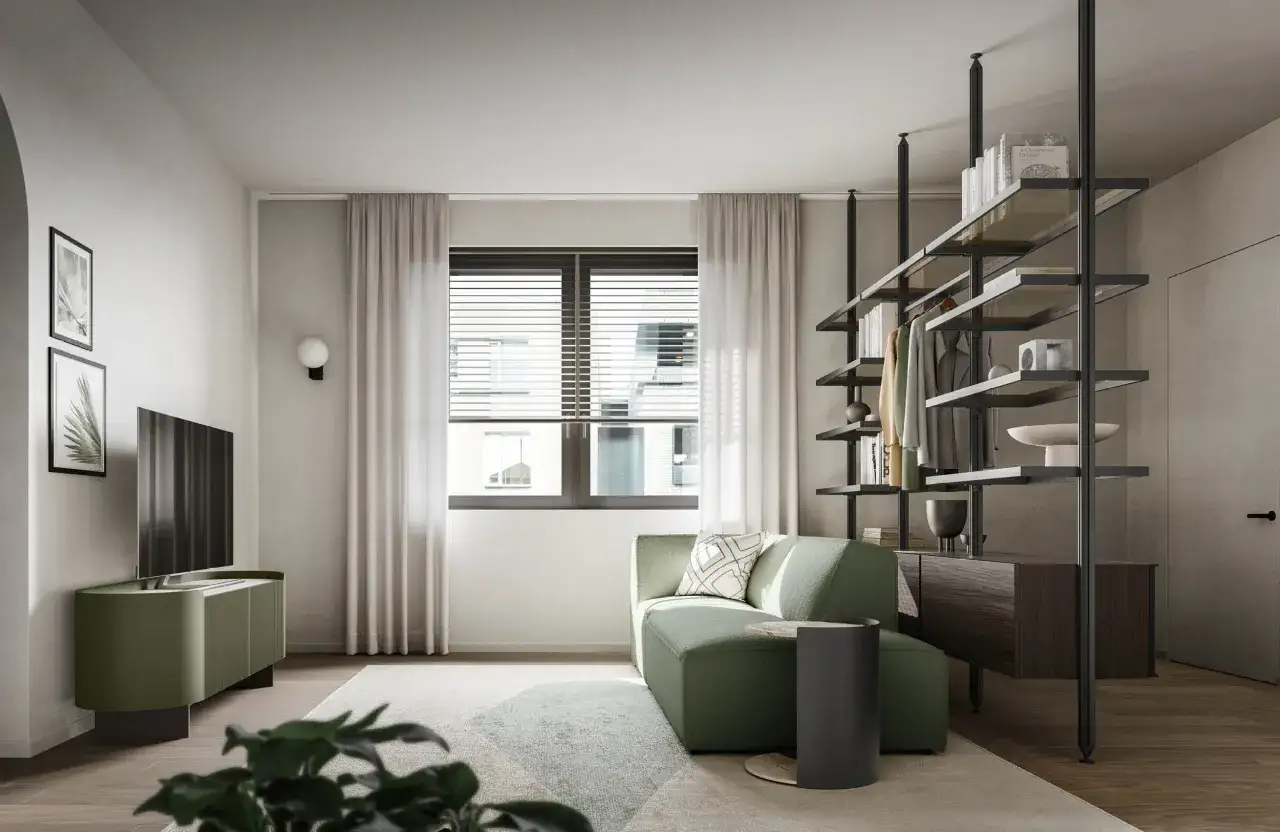 Soggiorno moderno con divano verde salvia, mobile TV e libreria. Ottimi abbinamenti verde salvia colore per un ambiente rilassante.