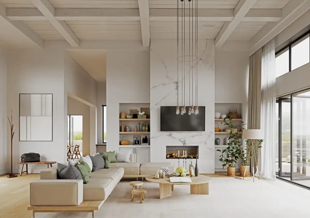 Soggiorno luminoso con divano beige, cuscini verdi e grigi che richiamano i colori primaverili. Camino moderno, tavolino in legno e piante verdi.