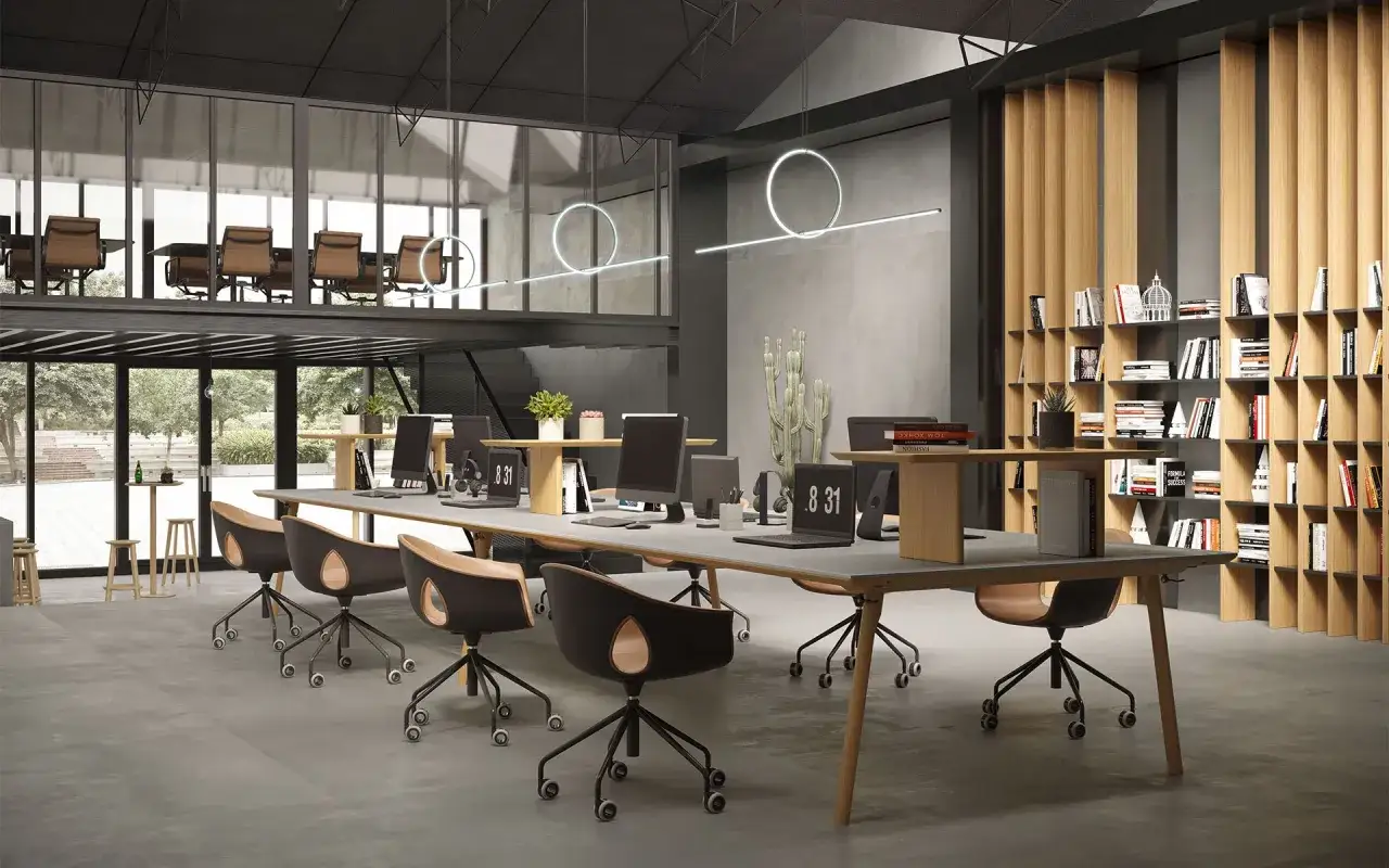 Spazi luminosi e moderni con scrivanie lunghe, sedie ergonomiche e librerie a parete. Ottime idee arredamento ufficio per un ambiente stimolante.