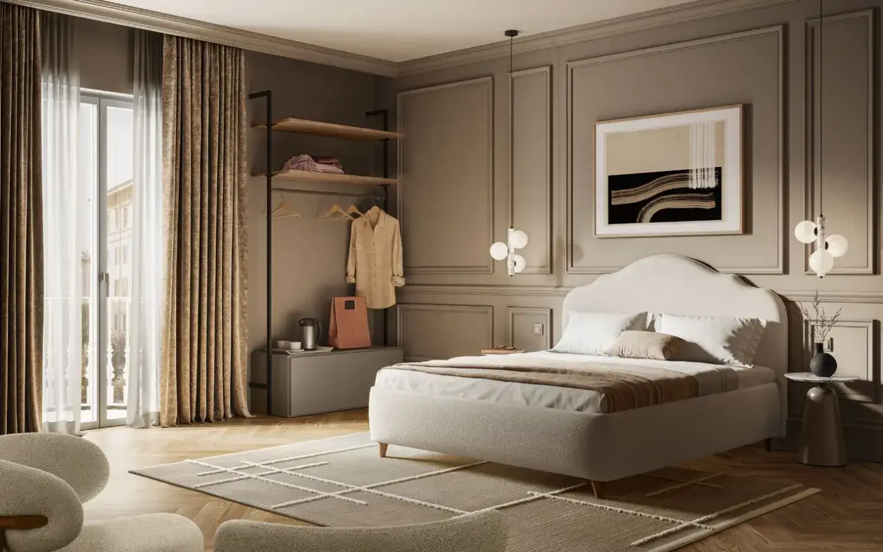 Camera da letto elegante, perfetta per arredare un B&B. Letto imbottito, armadio aperto, poltrone e un quadro astratto.