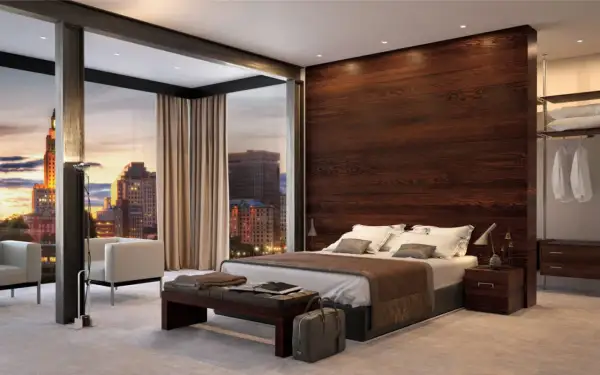 Elegante parete dietro letto in legno scuro, con vista panoramica sulla città al tramonto. Idee d'arredo moderne e raffinate.
