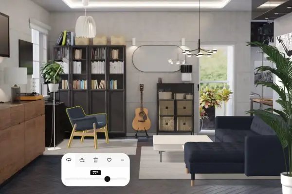 Arredamento studio casa: soggiorno moderno con divano blu, librerie, poltrona, chitarra e un pannello di controllo temperatura.