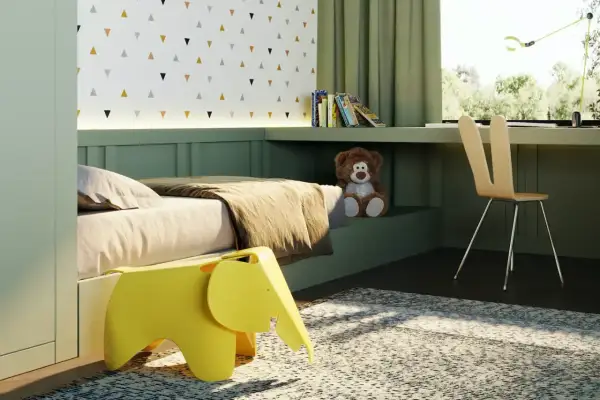 Arredamento camera neonato: letto accogliente, sgabello a forma di elefante giallo, orsacchiotto e scrivania con vista sul verde.